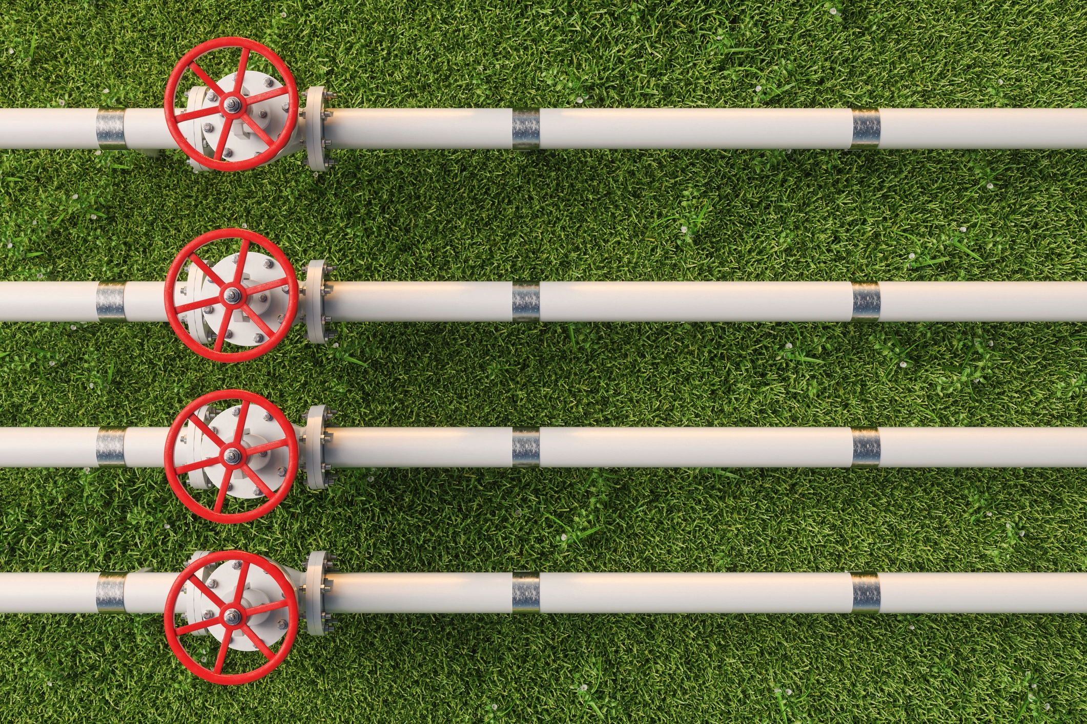 Aerial view of pipeline valves on grass