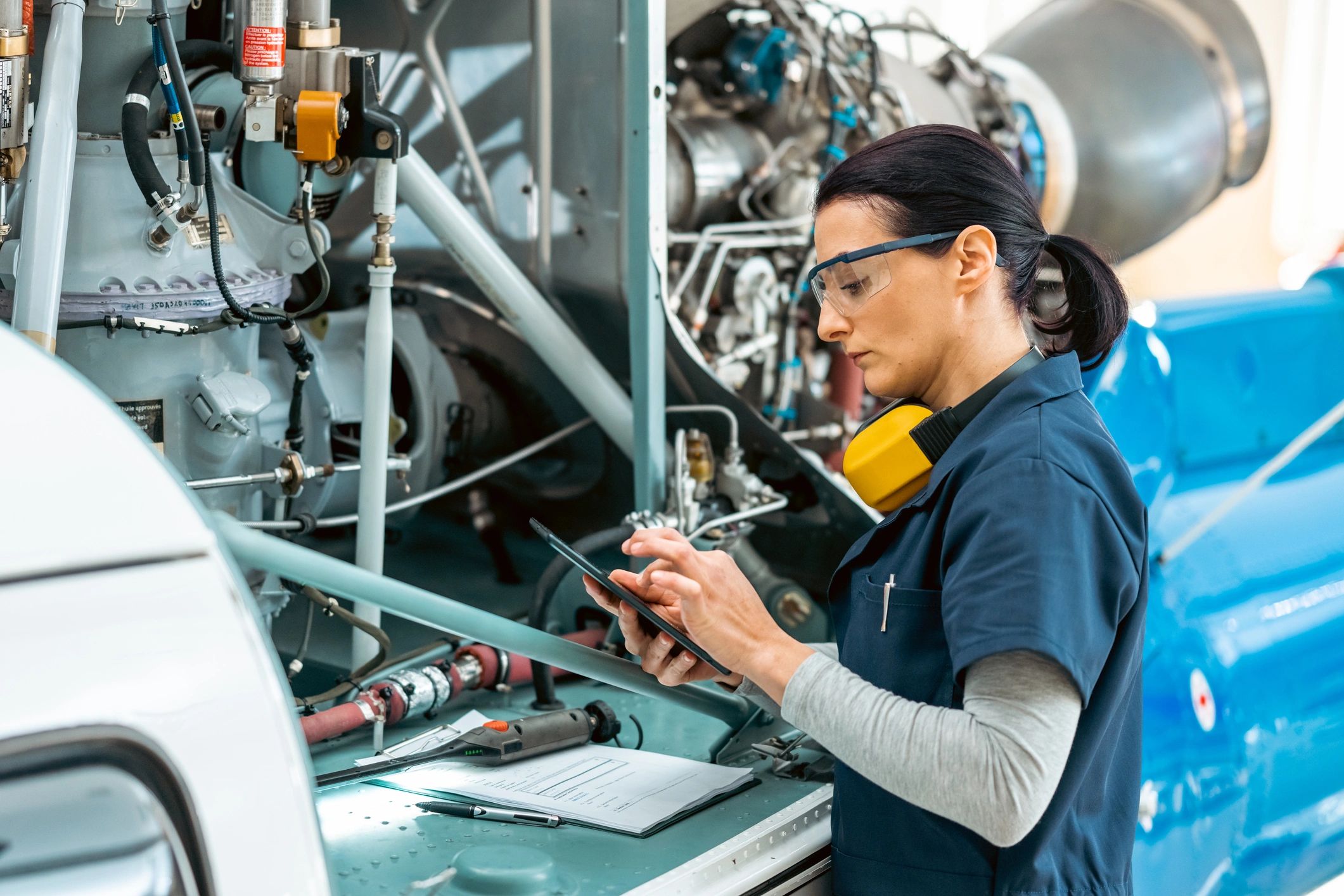 Engineer reviewing a maintenance checklist on a tablet
