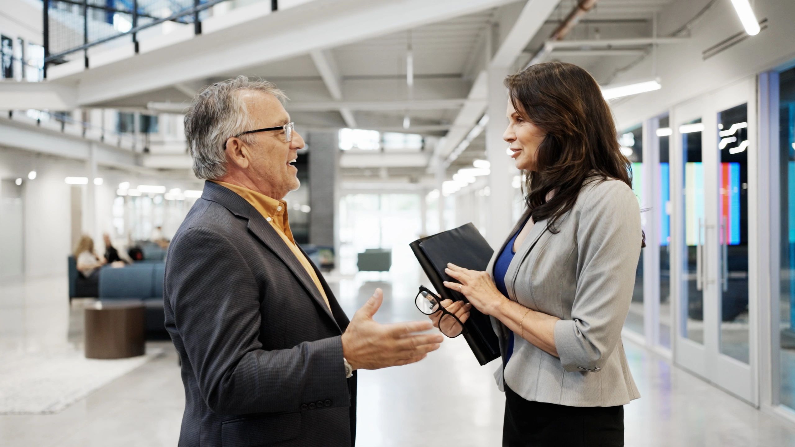 Business professional in discussion at a conference